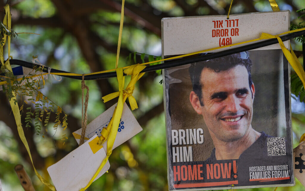A picture of slain hostage Dror Or, whose body was returned from the Gaza Strip on Tuesday, is seen at Hostages Square in Tel Aviv, November 26, 2025. (Miriam Alster/Flash90)