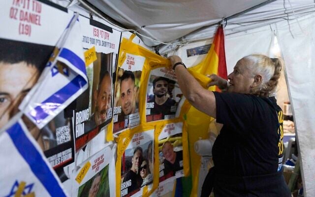 Activists dismantle the Hostages' Tent that has been set up outside the Prime Minister's Residence in Jerusalem for almost two years, on November 29, 2025. (Yonatan Sindel/Flash90)