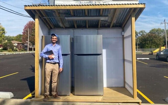 Rabbi Hody Nemes stands in front of Hersh's Fridge, a community fridge that serves needy people in Chicago. (Courtesy Nemes)