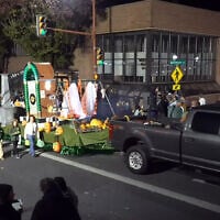 Footage from the Hanover Halloween Parade, held on October 31, 2025, shows a copy of the Auschwitz death camp gate on a float pulled through a town street by a pickup truck. (YouTube screenshot)