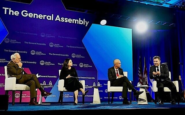 Author Sarah Hurwitz appears on a panel at the annual General Assembly of the Jewish Federations of North America, alongside, from left, Eric Fingerhut, JFNA’s president and CEO; Israeli author Micah Goodman, and Richard Marceau of Canada’s Centre for Israel and Jewish Affairs, Washington, DC, November 16, 2025. (Courtesy JFNA via JTA) Author Sarah Hurwitz appears on a panel at the annual General Assembly of the Jewish Federations of North America, alongside, from left, Eric Fingerhut, JFNA’s president and CEO; Israeli author Micah Goodman, and Richard Marceau of Canada’s Centre for Israel and Jewish Affairs, Washington, DC, November 16, 2025. (Courtesy JFNA via JTA)