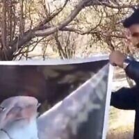 Screen capture from video of Iranian Omid Sarlak burning an image of Supreme Leader Ayatollah Ali Khamenei on October 31, 2025. Hours later he was found dead of a gunshot wound. (X)