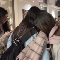 A screengrab of a video showing unveiled women attending an art show at Tehran Design Week, released November 14, 2025. (YouTube)