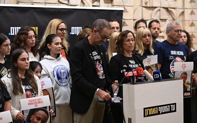 Ronen and Orna Neutra speak to the media about their son, Omer Neutra, on November 3, 2025, a day after his body was returned to Israel from Gaza. (Lior Rotstein/Hostages Forum)