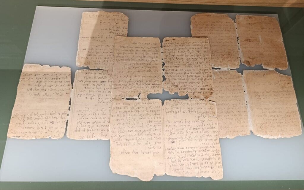 A handwritten Rosh Hashanah prayerbook written from memory in the Wolfsberg labor camp by Cantor Naftali Stern, displayed in Yad Vashem's Living Memory exhibition (Zev Stub/Times of Israel)