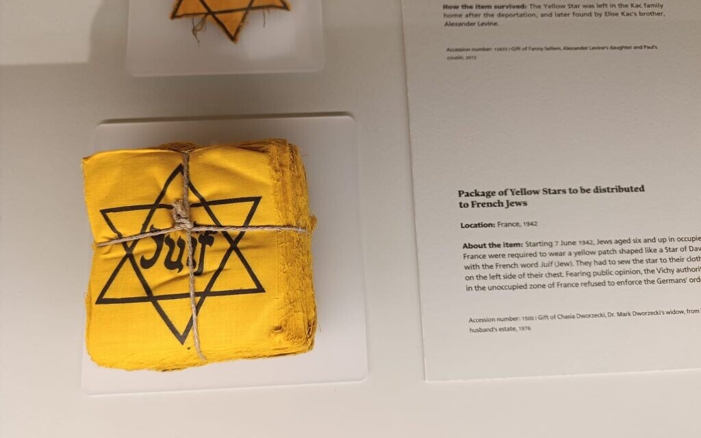 A package of yellow Stars of David to be distributed to French Jews in 1942, displayed in Yad Vashem's Living Memory exhibition (Zev Stub/Times of Israel)