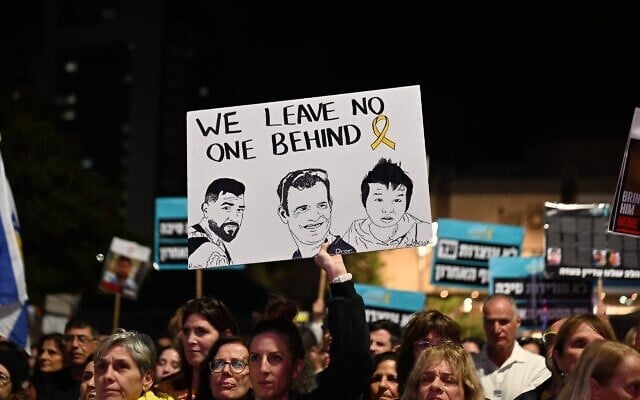 Demonstrators call for the return of the remaining three deceased hostages held in Gaza, at Hostages Square in Tel Aviv, November 15, 2025. (Paulina Patimer/Hostages and Missing Families Forum)