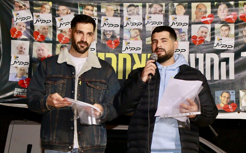 Freed hostages Gali and Ziv Berman speak at a rally for the release of hostages, at Sha'ar HaNegev Junction, November 15, 2025. (Erez Volach/Hostages and Missing Families Forum)