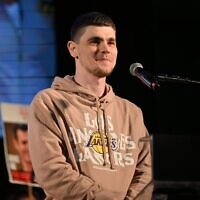 Released hostage Maxim Herkin speaks at a rally at Hostages Square, Tel Aviv, November 15, 2025. (Paulina Patimer/Hostages and Missing Families Forum)