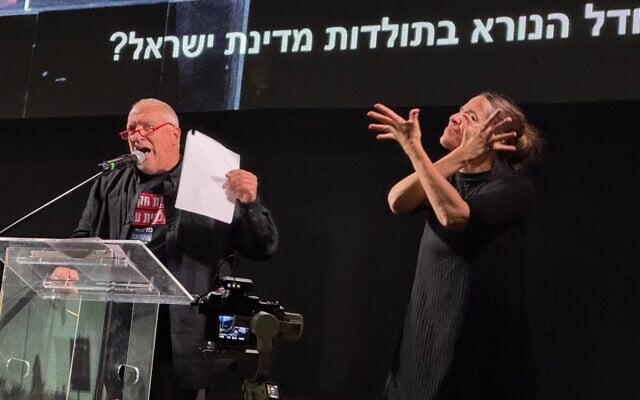 Eyal Eshel, whose daughter Roni was murdered on October 7, 2023, speaks at an anti-government protest at Habima Square, Tel Aviv, November 15, 2025. (Vardit Alon-Korpel/Pro-Democracy Protest Movement) Eyal Eshel, whose daughter Roni was murdered on October 7, 2023, speaks at an anti-government protest at Habima Square, Tel Aviv, November 15, 2025. (Vardit Alon-Korpel/Pro-Democracy Protest Movement)