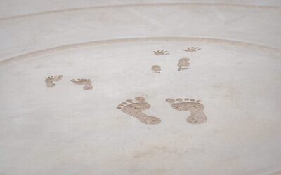 The 'footprints' of Shiri, Ariel, and Kfir Bibas in the center of a new memorial at Kibbutz Tzeelim, where Yarden Bibas grew up. The mother and two young boys were abducted from Kibbutz Nir Oz on October 7, 2023, and subsequently murdered in captivity. (Talia Ben Harush)