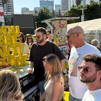 Alon Ohel, top left, with his family at Hostages Square on November 19, 2025 (Hostages Forum)