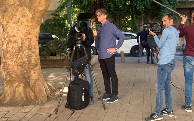 Richard Trank (left), filming in Tel Aviv in December 2019. (Courtesy)