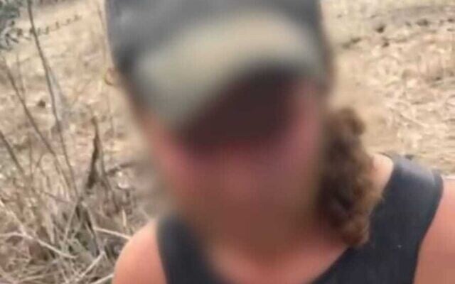 A blurred-out photo of one of the suspected attackers in a large-scale assault on Palestinian property in the northern West Bank on November 11, 2025, shared by the police on November 22, 2025. (Israel Police)