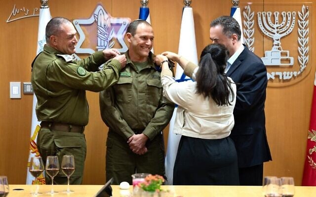 Military Advocate General Maj. Gen. Itai Ofir (center) is awarded his ranks by IDF Chief of Staff Lt. Gen. Eyal Zamir (left), Defense Minister Israel Katz (right), and Ofir's wife Ronit at the IDF HQ in Tel Aviv, November 27, 2025. (Israel Defense Forces)