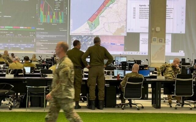 Officers and civilians from the US, Israel and around 20 other countries work at the Civil-Military Coordination Center in Kiryat Gat, Israel, November 19, 2025 (Lazar Berman/The Times of Israel)