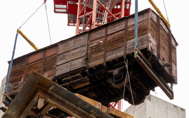 A 173-foot tower crain hoists a 20th century 12-ton railcar into the upcoming Holocaust Museum Boston. (Kenneth Berman Photography via JTA) A 173-foot tower crain hoists a 20th century 12-ton railcar into the upcoming Holocaust Museum Boston. (Kenneth Berman Photography via JTA)