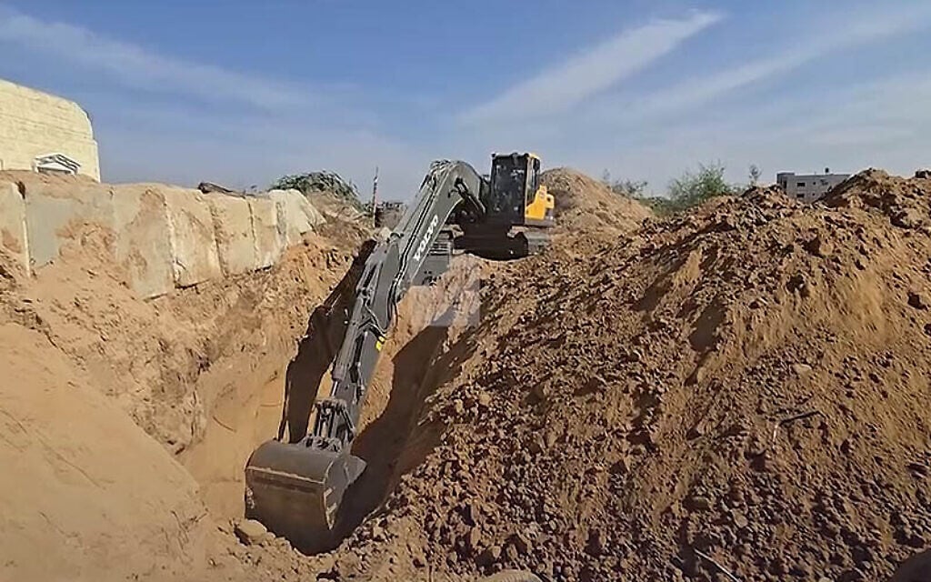 Footage released on social media on November 2, 2025, showing the apparent retrieval of remains of a deceased hostage held in Gaza. (Screenshot/Al-Arabiya via X) Footage released on social media on November 2, 2025, showing the apparent retrieval of remains of a deceased hostage held in Gaza. (Screenshot/Al-Arabiya via X)