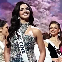 Miss Israel, Melanie Shiraz, looks in the direction of Miss Palestine, Nadeen Ayoub, at the 2025 Miss Universe pageant in Thailand in November 2025. (Screenshot from social media)