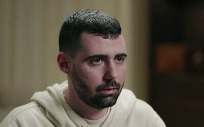 Freed captive Guy Gilboa-Dalal speaks during an interview on Channel 12 News which aired on November 22, 2025. (Screenshot)