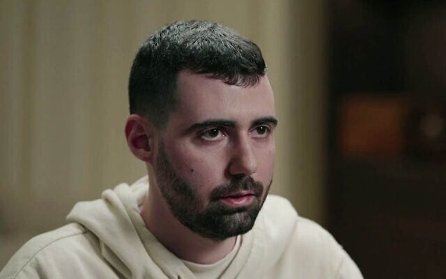 Freed captive Guy Gilboa-Dalal speaks during an interview on Channel 12 News which aired on November 22, 2025. (Screenshot)