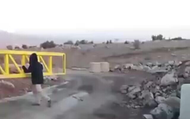 An Israeli settler activist opens a military gate on the border with Syria in the Golan Heights, November 27, 2025. (Halutzey Habashan) An Israeli settler activist opens a military gate on the border with Syria in the Golan Heights, November 27, 2025. (Halutzey Habashan)