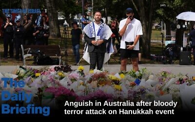 Rabbi Yossi Friedman, left, holds a prayer at a flower memorial for shooting victims outside the Bondi Pavilion at Sydney's Bondi Beach on December 15, 2025, a day after the deadly terror attack targeting Jews. (AP/Mark Baker) Rabbi Yossi Friedman, left, holds a prayer at a flower memorial for shooting victims outside the Bondi Pavilion at Sydney's Bondi Beach on December 15, 2025, a day after the deadly terror attack targeting Jews. (AP/Mark Baker)
