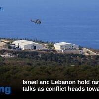 FILE - A helicopter flies over a base of the UN peacekeeping force, in the southern town of Naqoura, Lebanon on Oct. 14, 2020. (AP Photo/Bilal Hussein, File)