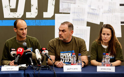 Col. (res.) German Giltman (center) is seen with other members of the 'Brothers in Arms' reservist protest group, during a press conference in Tel Aviv, March 21, 2023. (REUTERS/Amir Cohen)