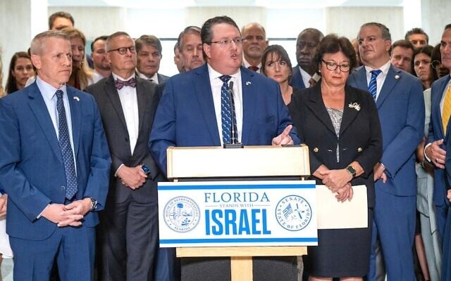Then-State Rep. Randy Fine, at podium, and colleagues from the Florida Legislature, endorse a proclamation backing Israel in the second week of its war with Hamas, October 18, 2023. (Florida Senate/Wikmedia via JTA)