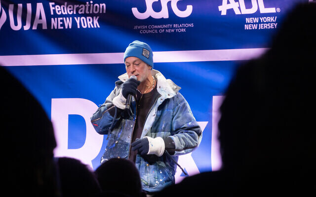 Matisyahu performs outside Park East Synagogue, in New York City, December 4, 2025. (Luke Tress/Times of Israel)
