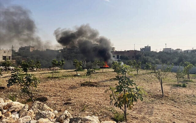 Illegal burning of electronic waste near Azzoun, northern West Bank, November 24, 2025. (Sue Surkes/Times of Israel)