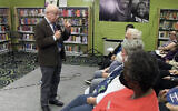 Screen capture from video of Holocaust survivor Sami Steigmann giving a lecture, 2022. (YouTube)