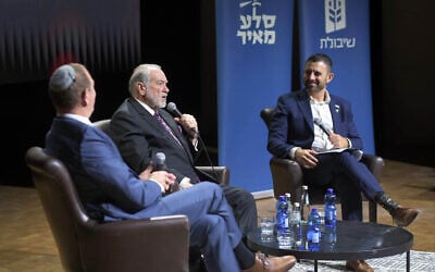 US Ambassador to Israel Mike Huckabee presents the book “When the Stones Speak” by Doron Spielman with the author (left) introduced by media personality Eylon Levy (right) at the National Library of Israel in Jerusalem on December 10, 2025. (Courtesy of Yaal Herman) US Ambassador to Israel Mike Huckabee presents the book “When the Stones Speak” by Doron Spielman with the author (left) introduced by media personality Eylon Levy (right) at the National Library of Israel in Jerusalem on December 10, 2025. (Courtesy of Yaal Herman)