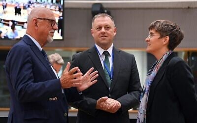 Irish Secretary of State for European Affairs Thomas Byrne, center, speaks with his Swedish counterpart Hans Dahlgren, left, and German counterpart Anna Luehrmann ahead of the General Affairs Council (GAC) meeting at the EU headquarters in Brussels, Belgium, on September 20, 2022. (John THYS / AFP)