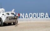 A United Nations peacekeeping force in Lebanon (UNIFIL) vehicle is stationed along the main road near Lebanon's southern town of Naqoura, close to the border with Israel, on October 27, 2022. (MAHMOUD ZAYYAT / AFP)