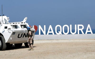 A United Nations peacekeeping force in Lebanon (UNIFIL) vehicle is stationed along the main road near Lebanon's southern town of Naqoura, close to the border with Israel, on October 27, 2022. (MAHMOUD ZAYYAT / AFP)
