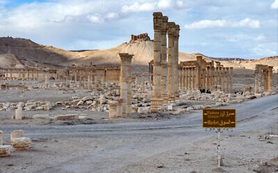 This view shows a destroyed section of the Great Colonnade (Decumanus Maximus) and the nearby 13th-century Mamluk-built Fakhr al-Din al-Maani Castle (Tadmur Castle) overlooking it, at the ancient ruins of Palmyra in central Syria on February 7, 2025. (Omar Haj Kadour/AFP)