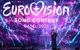 Austrian singer JJ performs after winning the grand final of the Eurovision Song Contest 2025, at the St. Jakobshalle arena in Basel, Switzerland, on May 18, 2025. (Fabrice COFFRINI / AFP)
