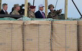 US President Donald Trump is joined by US military and civilian leaders as they watch a demonstration by special operations soldiers at the Holland Drop Zone on June 10, 2025, in Fort Bragg, North Carolina. (Anna Moneymaker/Getty Images via AFP)
