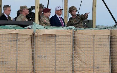 US President Donald Trump is joined by US military and civilian leaders as they watch a demonstration by special operations soldiers at the Holland Drop Zone on June 10, 2025, in Fort Bragg, North Carolina. (Anna Moneymaker/Getty Images via AFP) US President Donald Trump is joined by US military and civilian leaders as they watch a demonstration by special operations soldiers at the Holland Drop Zone on June 10, 2025, in Fort Bragg, North Carolina. (Anna Moneymaker/Getty Images via AFP)