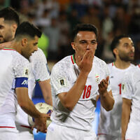 Iran's midfielder #18 Amirhossein Hosseinzadeh celebrates scoring his team's third goal during the FIFA World Cup 2026 Asia zone qualifiers group A football match between Iran and the North Korea at the Azadi Sports Complex in Tehran on June 10, 2025. (Photo by ATTA KENARE / AFP)