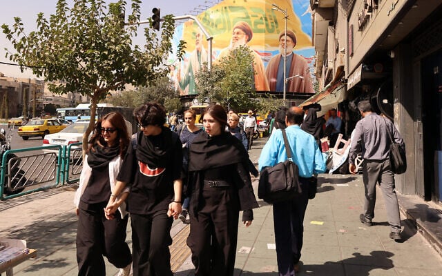 Iranian women walk in front of a billboard depicting slain Hezbollah leader Hassan Nasrallah (C) and his successor Hashem Safieddine (R) as well as the late Iranian General Qasem Soleimani, in Tehran on September 28, 2025.(Atta Kenare/AFP) Iranian women walk in front of a billboard depicting slain Hezbollah leader Hassan Nasrallah (C) and his successor Hashem Safieddine (R) as well as the late Iranian General Qasem Soleimani, in Tehran on September 28, 2025.(Atta Kenare/AFP)