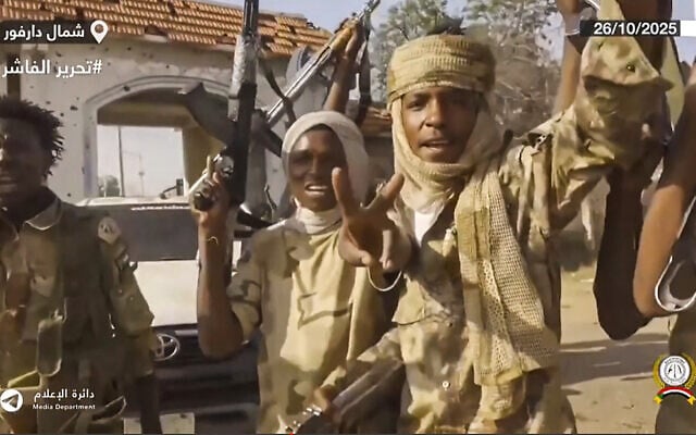 This image grab taken from handout video footage released on Sudan's paramilitary Rapid Support Forces (RSF) Telegram account on October 26, 2025, shows RSF fighters holding weapons and celebrating in the streets of El-Fasher in Sudan's Darfur. (RSF/AFP) This image grab taken from handout video footage released on Sudan's paramilitary Rapid Support Forces (RSF) Telegram account on October 26, 2025, shows RSF fighters holding weapons and celebrating in the streets of El-Fasher in Sudan's Darfur. (RSF/AFP)