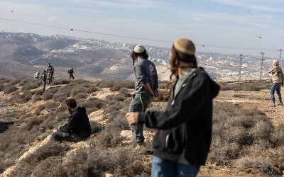 Illustrative: Israeli security forces clash with Hilltop Youth as they evacuate and demolish an illegal outpost built near the Jewish settlement of Metzad, east of the Palestinian city of Sa'ir in the southern West Bank on November 17, 2025. (Menahem Kahana/AFP)