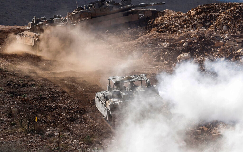 Israeli tanks patrol close to the border fence separating northern Israel from southern Lebanon on November 24, 2025. (Photo by Jalaa MAREY / AFP) Israeli tanks patrol close to the border fence separating northern Israel from southern Lebanon on November 24, 2025. (Photo by Jalaa MAREY / AFP)