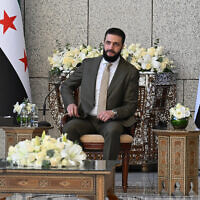 Syrian President Ahmed al-Sharaa attends a reception with United Nations Security Council delegation at the Presidential Palace in Damascus, Syria, on December 4, 2025. (LOUAI BESHARA / AFP)