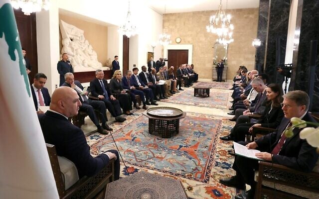 A handout photograph released by the Lebanese presidency's press office shows Lebanese President Joseph Aoun (L) speaking with Slovenia's UN Ambassador Samuel Zbogar (R) during a meeting with a United Nations Security Council delegation at the Presidential Palace of Baabda, east of Beirut, on December 5, 2025. (Handout / Lebanese Presidency / AFP)