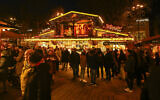 Illustrative: Visitors walk at the Christmas market in Dortmund, western Germany, on December 5, 2025. (Ina Fassbender/AFP)