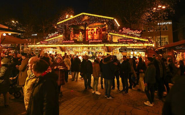 Illustrative: Visitors walk at the Christmas market in Dortmund, western Germany, on December 5, 2025. (Ina Fassbender/AFP) Illustrative: Visitors walk at the Christmas market in Dortmund, western Germany, on December 5, 2025. (Ina Fassbender/AFP)